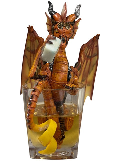 My Store Steampunk dragon figurine in orange and gold, holding a drink with ice and a lemon twist in a glass.