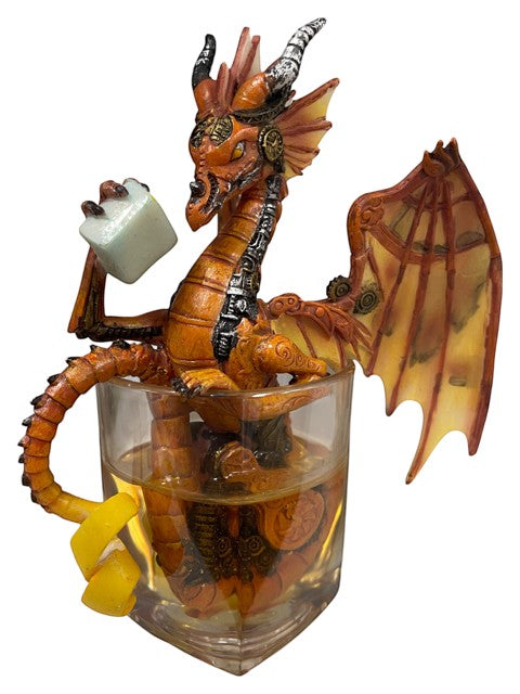 My Store Steampunk dragon figurine in orange and silver, holding an ice cube, sitting in a whiskey glass with lemon peel.