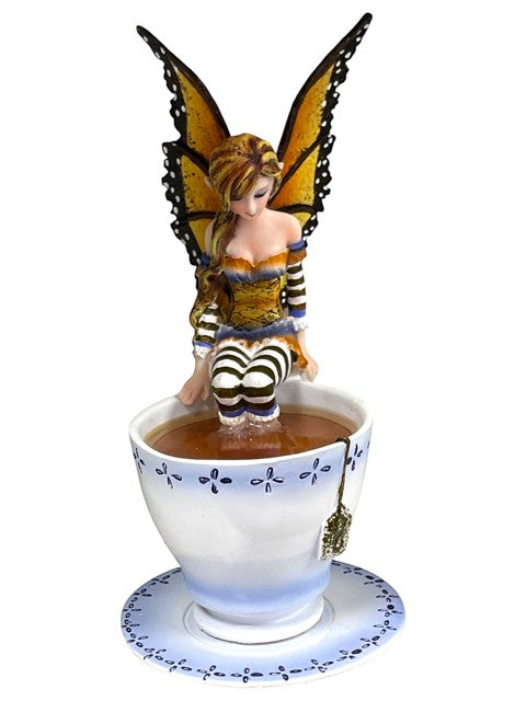 My Store Warm Toes Faery figurine by Amy Brown Art, sitting in a teacup with monarch butterfly wings.