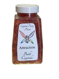 My Store Crystal Fairy Patch Attraction Bath Salts in a clear square bottle with a white lid. Rose-colored bath crystals.