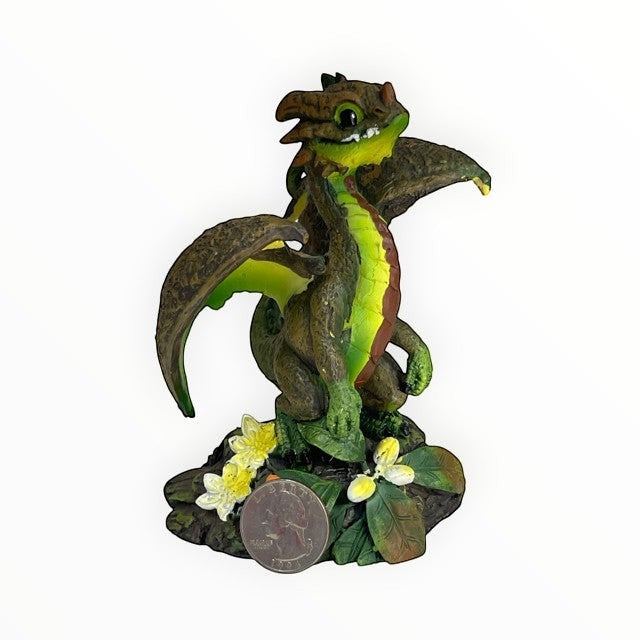 My Store Green Thumb Garden Fruits Series "Avocado Dragon" figurine by Stanley Morrison. This resin figurine features a small green and brown dragon with yellow accents, sitting on a rock with flowers.