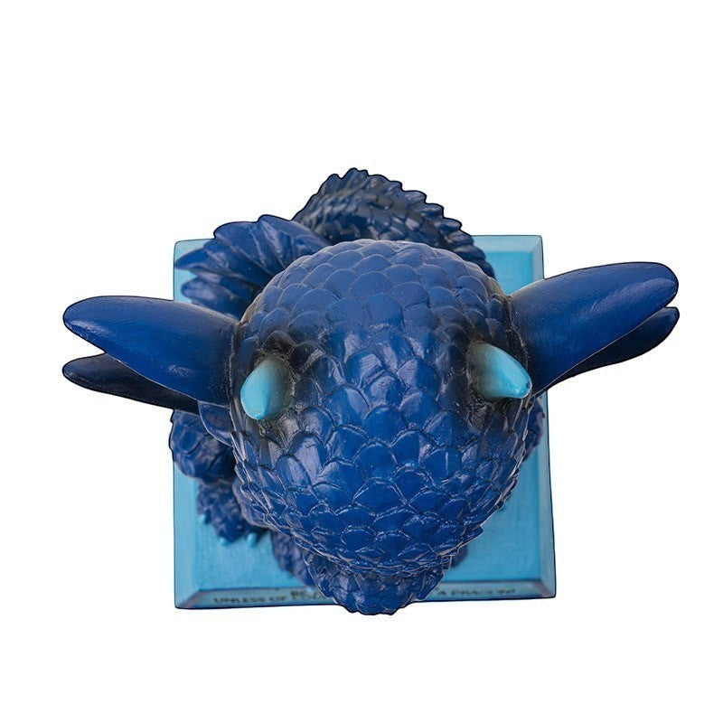 My Store blue dragon figurine with textured scales and light blue eyes, mounted on a light blue base with text.