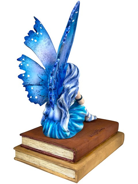 My Store Book Muse Fairy Figurine with blue hair, blue butterfly wings, and blue dress, seated on books.