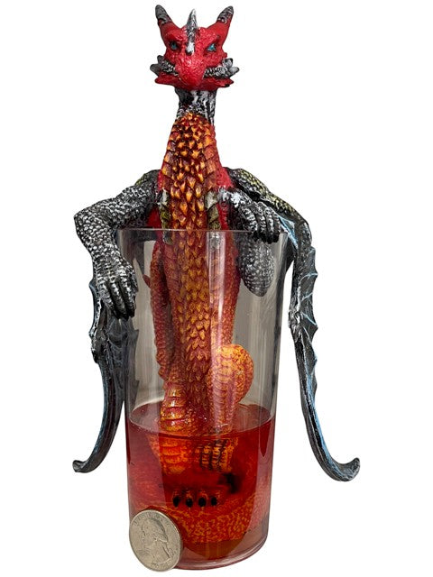 My Store red and orange dragon figurine sitting in a glass with red liquid, detailed scales and wings.