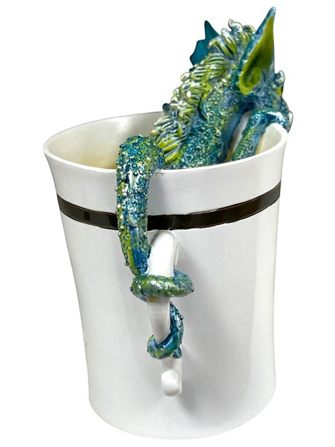 My Store white ceramic mug with a teal and green dragon sculpture wrapped around the handle and peeking over the rim.