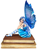 My Store Book Muse Fairy Figurine with blue hair, blue butterfly wings, and striped stockings, seated on books.