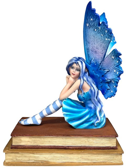 My Store Book Muse Fairy Figurine with blue hair, blue butterfly wings, and striped stockings, seated on books.