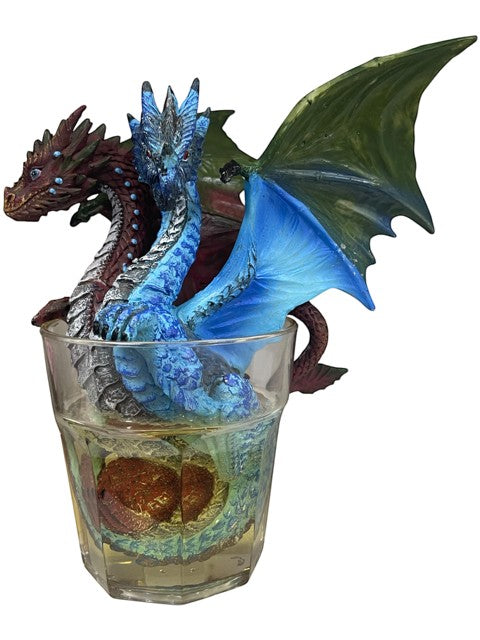 My Store Drinks and Dragons Series "Gin and Tonic" Dragon Figurine by Stanley Morrison. Blue and red dragons emerge from a clear glass filled with yellow liquid.
