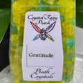 My Store Gratitude Bath Crystals in yellow and green hues, intended to enhance feelings of gratitude.