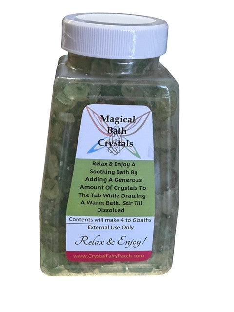My Store grounding bath salts in a clear plastic jar with a white lid. Green crystals for energy balancing.