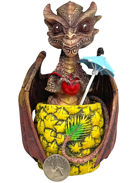 My Store Mai Tai Dragon figurine by Stanley Morrison, a brown dragon holding a red apple, sitting in a pineapple cup with a blue umbrella.