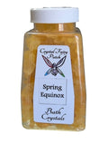 My Store Spring Equinox Bath Crystals in a clear bottle with a white lid. Yellow crystals.