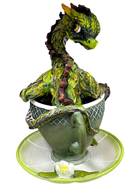 My Store green tea dragon figurine coiled in a teacup with a saucer decorated with a flower.