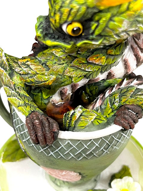 My Store Tea Dragon figurine, green dragon with yellow eyes peeking out of a teacup.