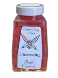 My Store Uncrossing Bath Crystals in a clear jar with a white lid, filled with red bath salts.