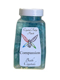 My StoreHere Crystal Fairy Patch Compassion Bath Salts in a clear bottle with blue crystals. Promotes empathy and kindness.