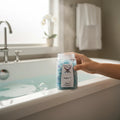My StoreHere Crystal Fairy Patch Super 7 Bath Salts in a clear jar, blue and purple crystals, next to a bathtub.