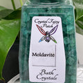 My StoreHere green Moldavite bath crystals in a clear container with a fairy logo and intention label.