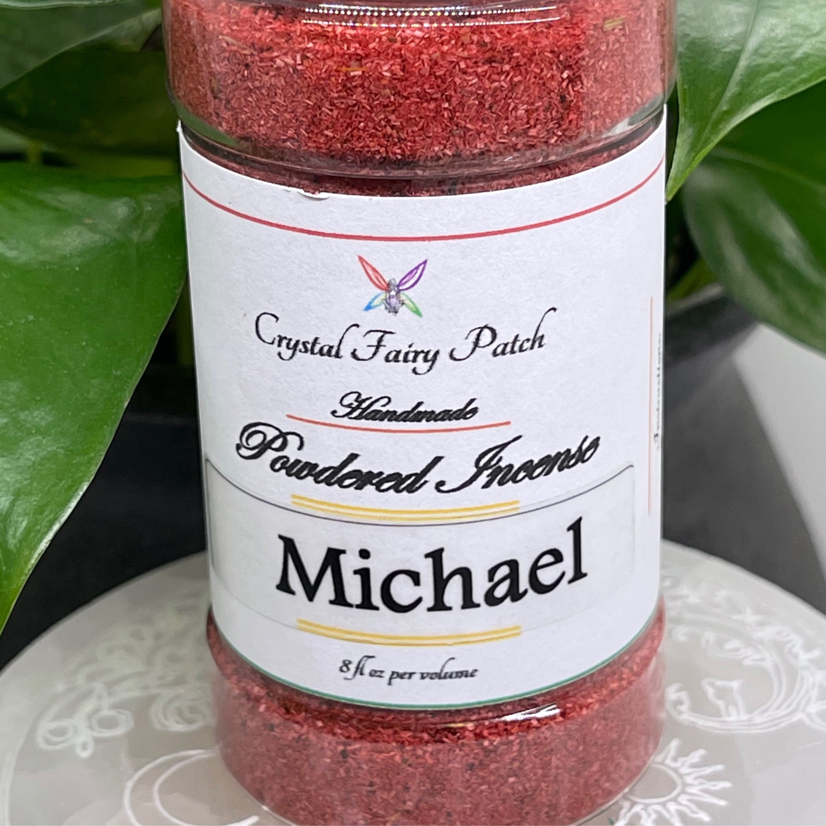 My StoreHere Crystal Fairy Patch Michael powdered incense in a clear jar, red-brown color, for healing, protection, and victory.